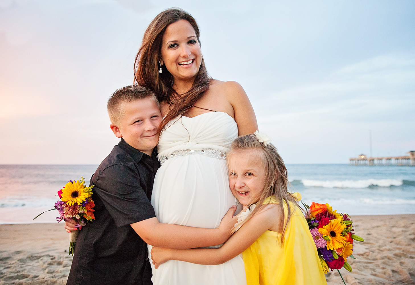 Pregnant bride with children in the Outer Banks of NC