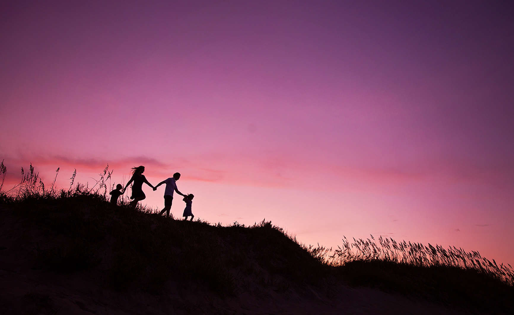 purple sunset family silhouette in OBX